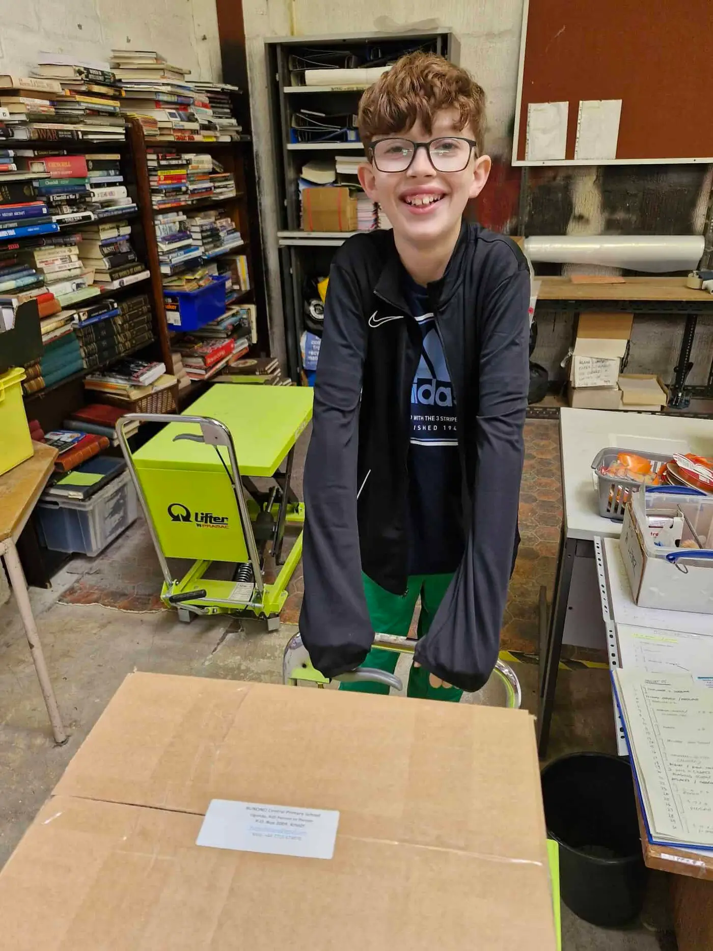 Grayson helping pack books